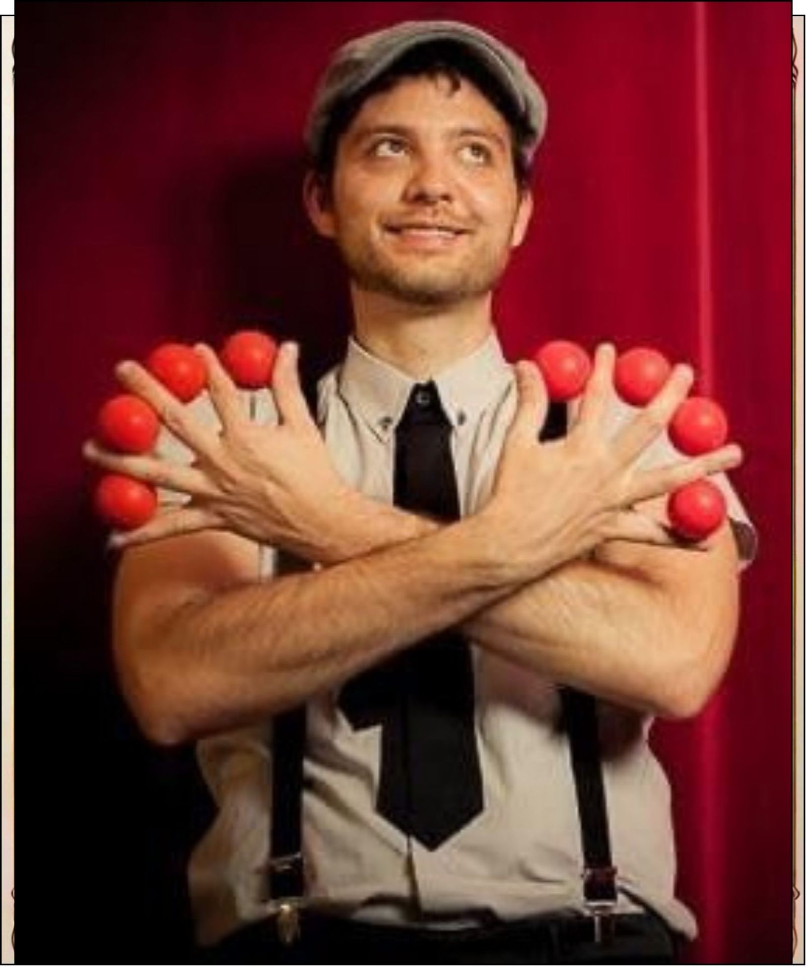 Magician Alexku with red magic balls between his hands